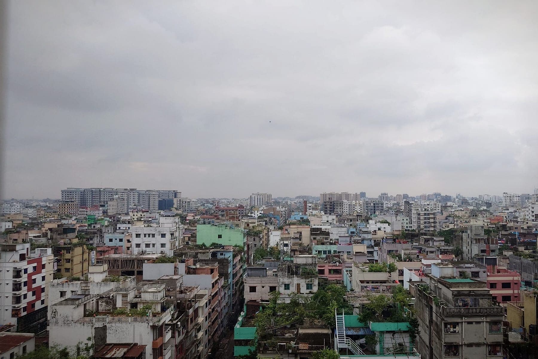 The dense city skyline of Dhaka seen from a high-rise